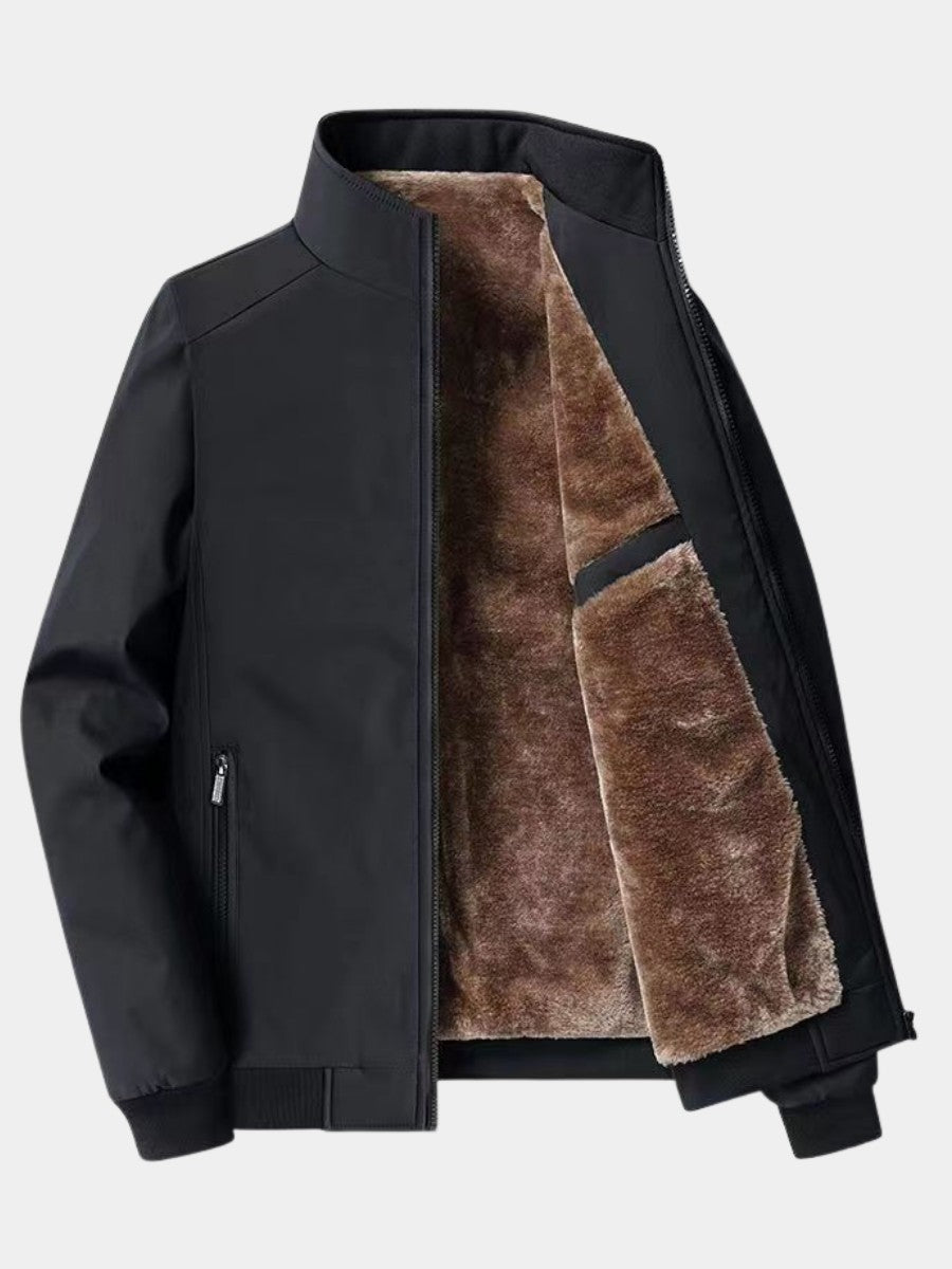 Blouson bombardier noir présenté ouvert sur sa doublure polaire brune, col montant et bas côtelé