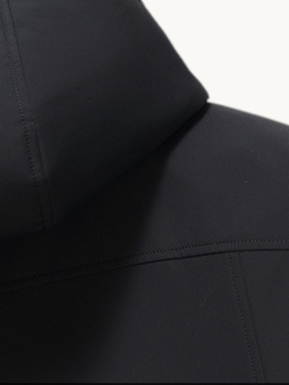 By Old Money black hooded parka with wool lining and detailed stitching on the hood and shoulder