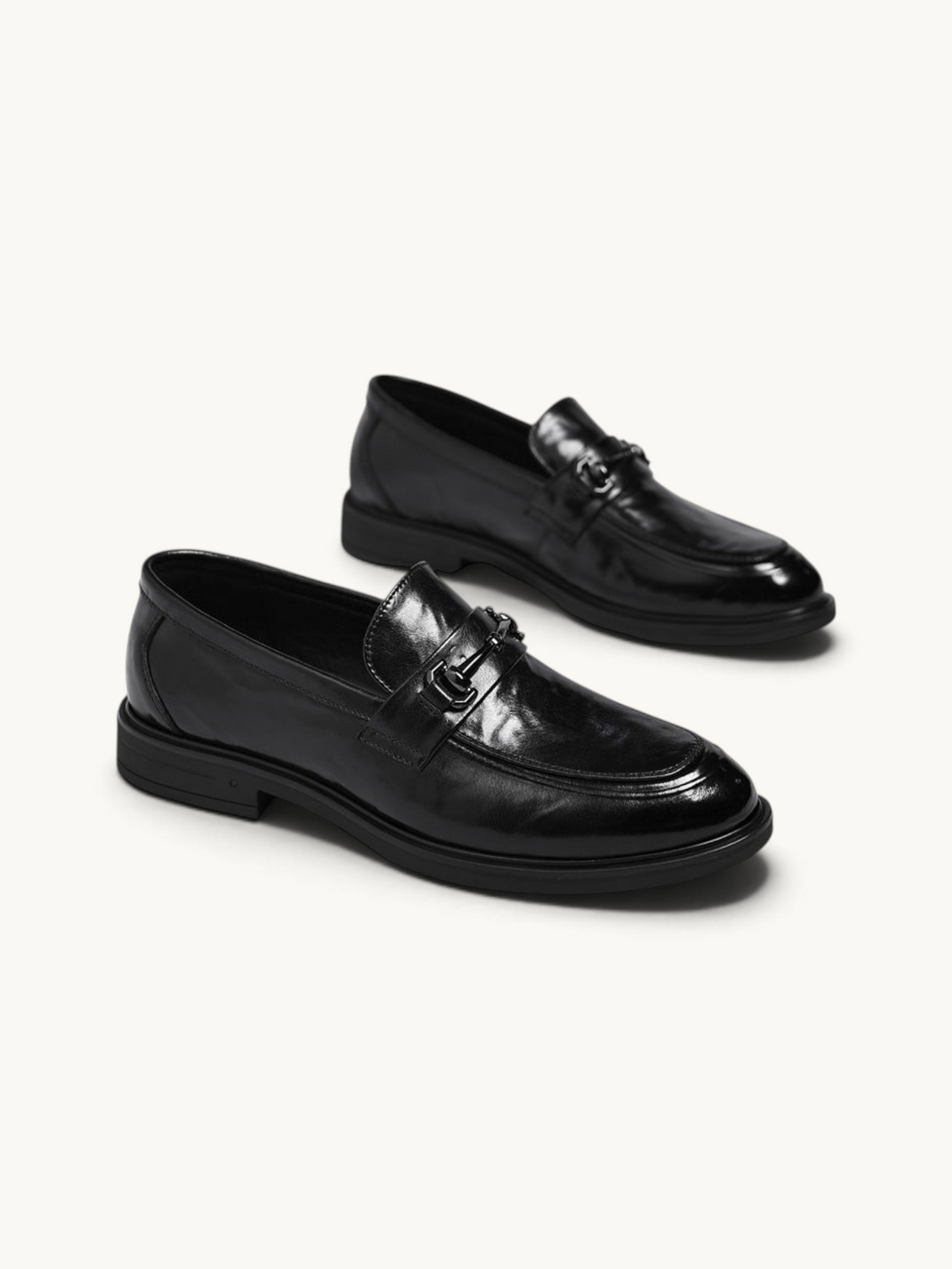 By Old Money black leather loafers with a polished finish, metal bit detail, and a classic slip-on silhouette.