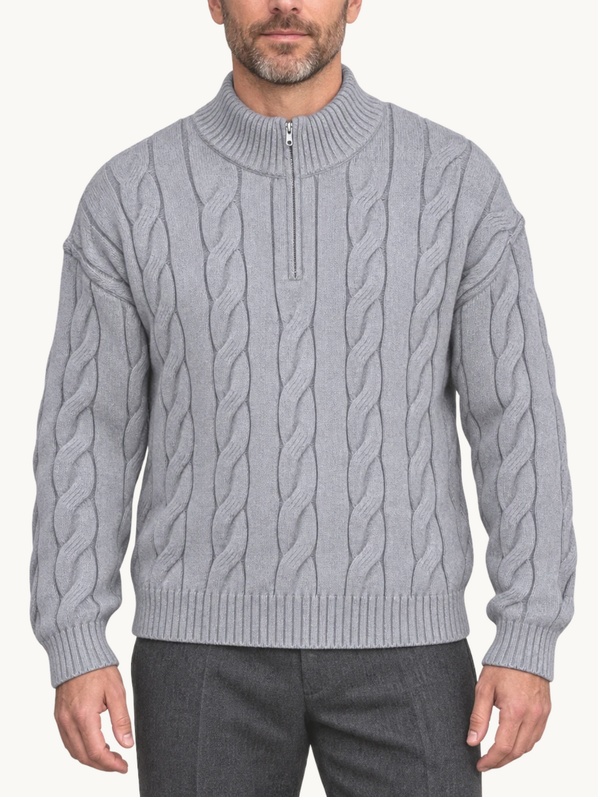 By Old Money grey cable knit half-zip sweater with a high collar worn by a man against a white background.