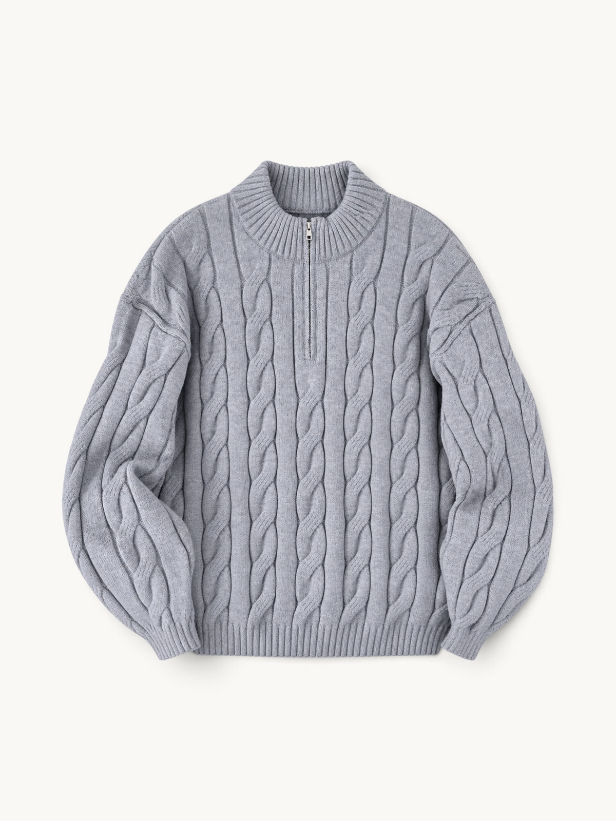 By Old Money grey cable knit half-zip sweater with a high collar and ribbed cuffs on a neutral background.
