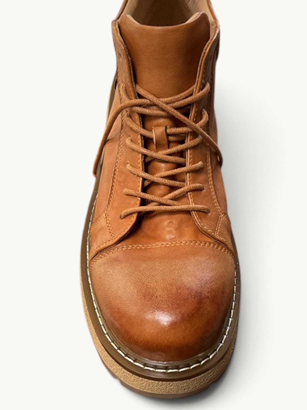 By Old Money tan full-grain leather work boots with a mid-high lace-up design and thick lugged sole.