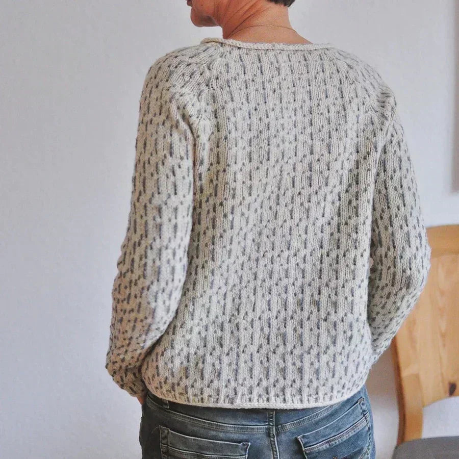 Pull texturé beige à motif moucheté, vue de dos