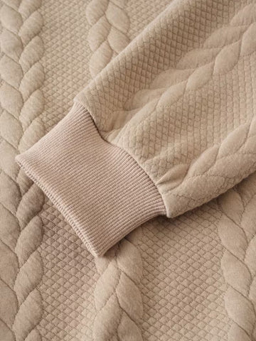 Pull torsadé col zippé