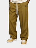 Pantalon large moutarde à pinces et cordon de serrage, détouré sur fond blanc