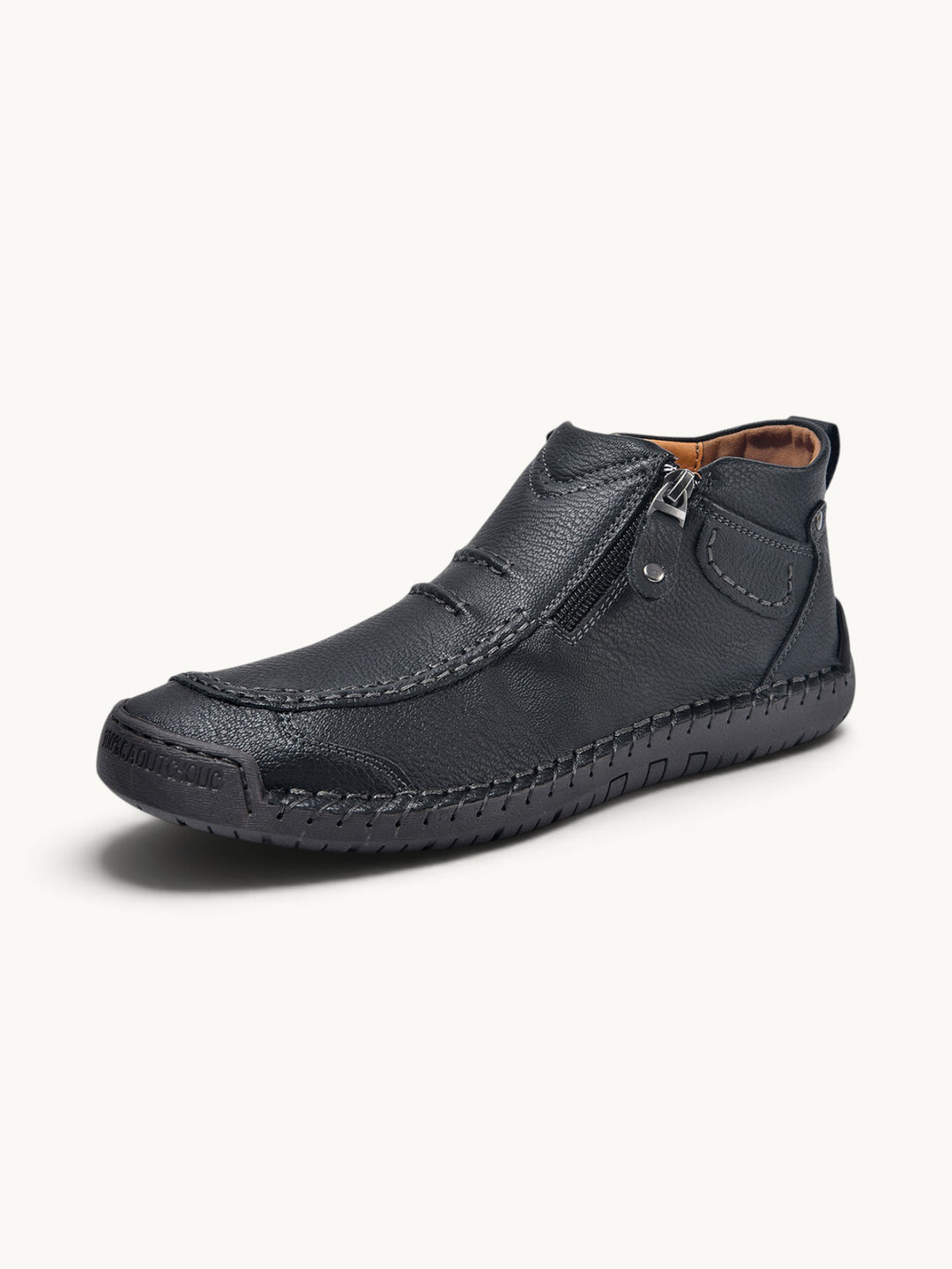 Bottine cuir noir avec fermeture éclair, détails piqûres apparentes et semelle texturée