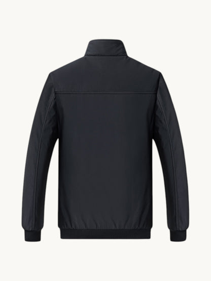 Blouson bombardier noir zippé vue arrière, doublure polaire, manches longues