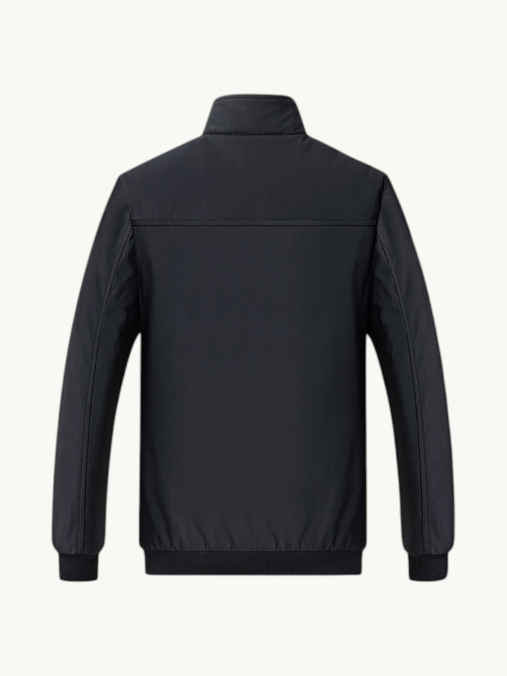 Blouson bombardier noir zippé vue arrière, doublure polaire, manches longues