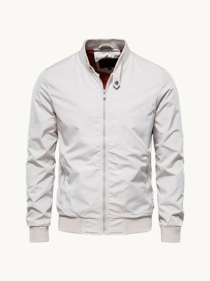 Blouson zippé blanc à col montant et doublure bordeaux