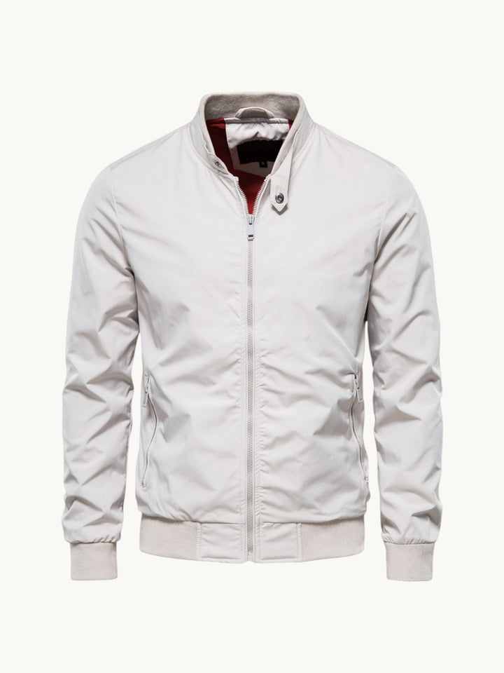 Blouson zippé blanc à col montant et doublure bordeaux