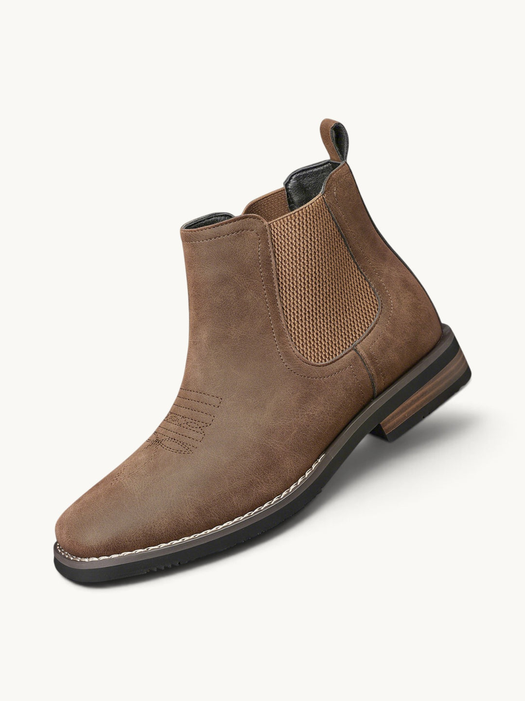 Bottine Chelsea en cuir marron avec élastique, semelle noire et couture blanche