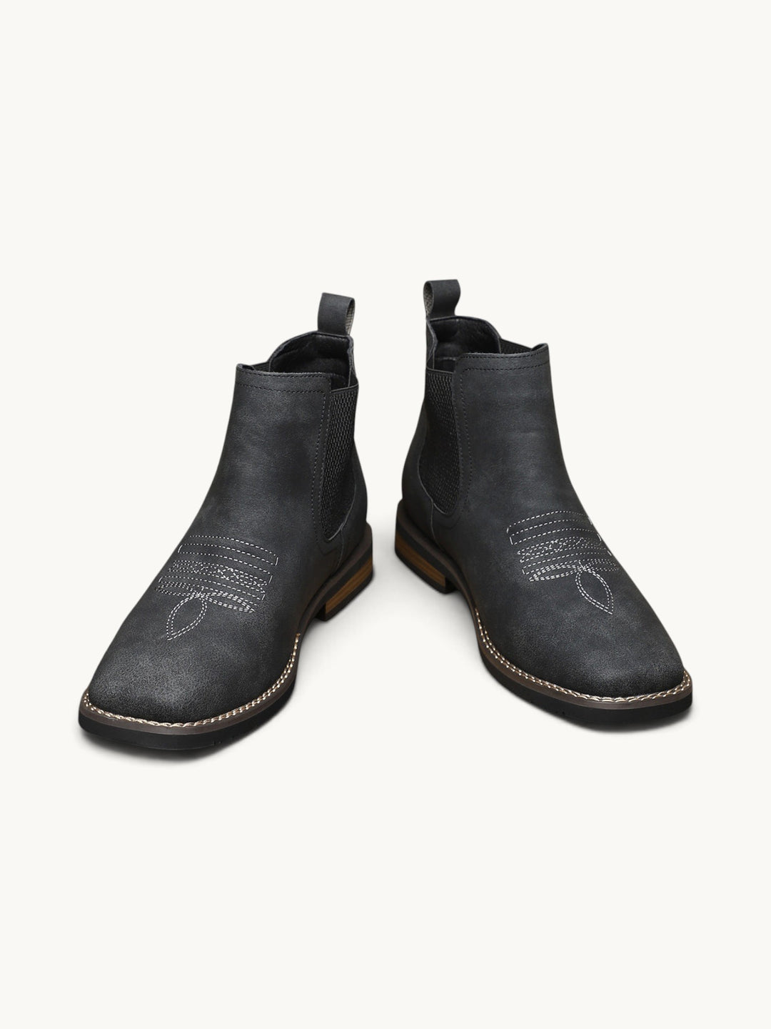 Bottines Chelsea en daim noir avec détails de couture ajourée