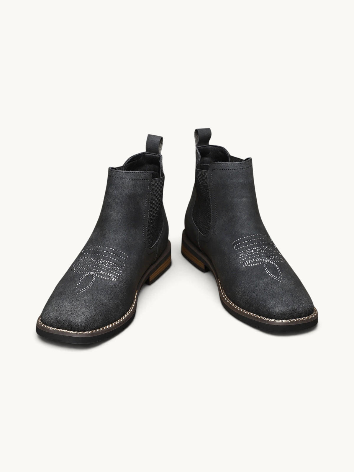 Bottines Chelsea en daim noir avec détails de couture ajourée