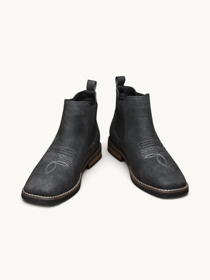Bottines Chelsea en daim noir avec détails de couture ajourée