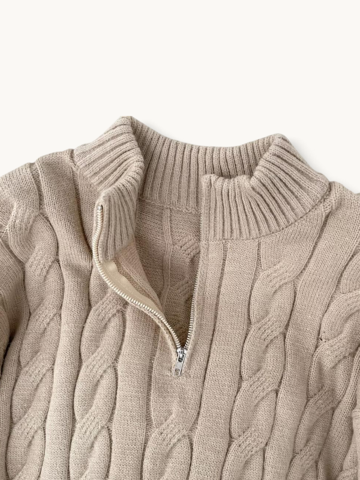 By Old Money beige cable knit sweater with a high collar and silver half-zip detail