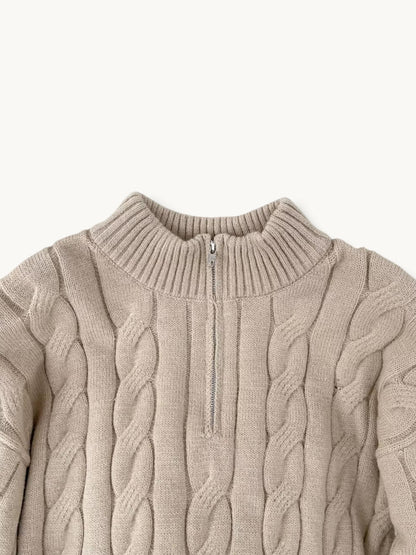 By Old Money beige cable knit sweater with a high collar and half-zip closure, featuring thick textured wool.
