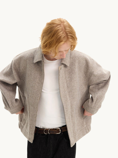 By Old Money beige double-faced wool boxy jacket with drop shoulders and front button closure on a model