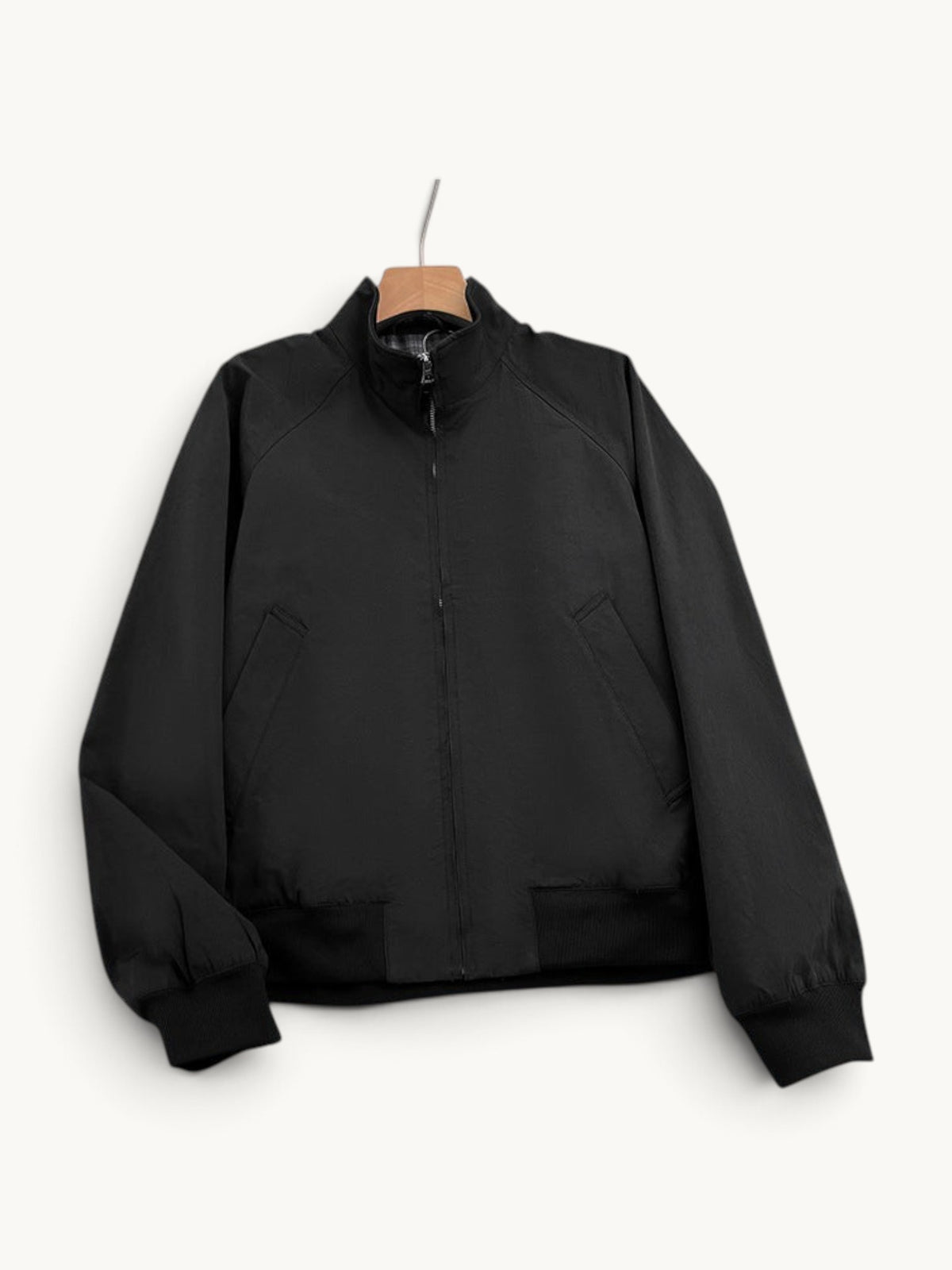 By Old Money black lightweight bomber jacket with a stand-up collar, full zip closure, and ribbed cuffs.