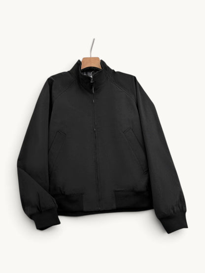By Old Money black lightweight bomber jacket with a stand-up collar, full zip closure, and ribbed cuffs.