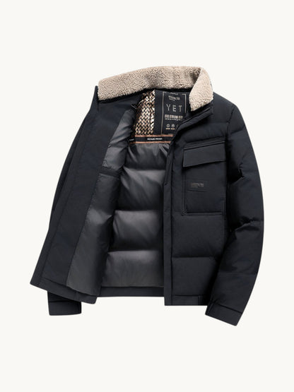 By Old Money black winter puffer jacket with a synthetic fur lapel collar, front flap pockets, and thick padding.