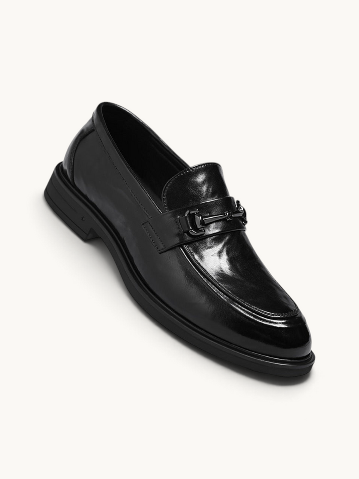 By Old Money black leather loafers with a polished finish and metal horsebit detail on a clean white background