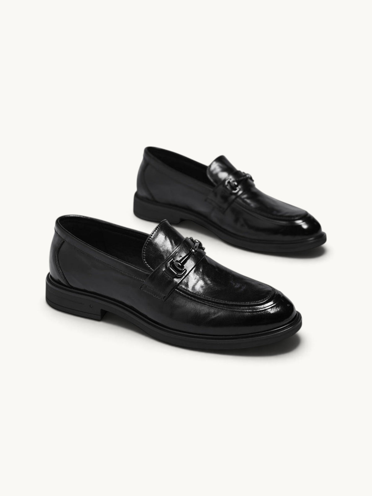 By Old Money black leather loafers with a polished finish, metal bit detail, and a classic slip-on silhouette.
