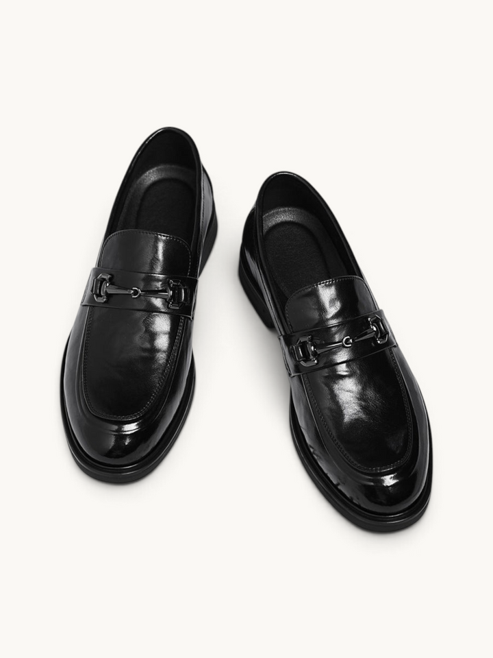 By Old Money black leather loafers with a polished finish and metal horsebit detail on a clean white background.