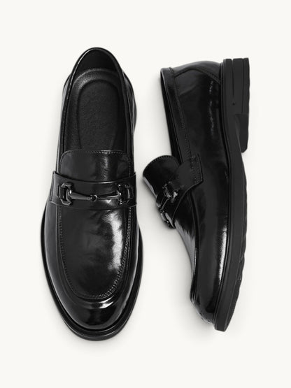 By Old Money black recycled leather loafers with a polished finish and metal bit detail, shown from above.