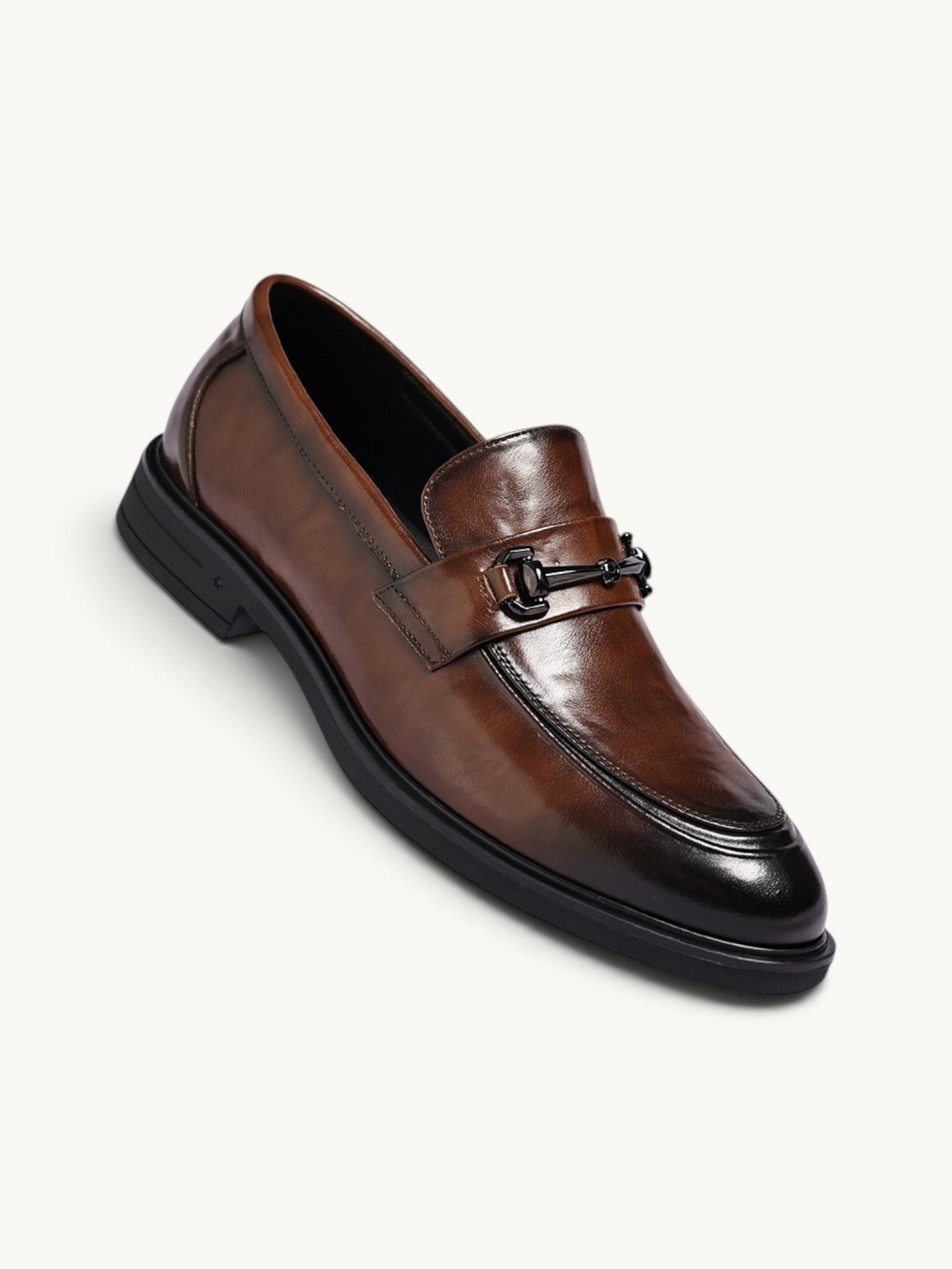 By Old Money brown leather loafers with a polished finish, black metal bit detail, and a sturdy black rubber sole.