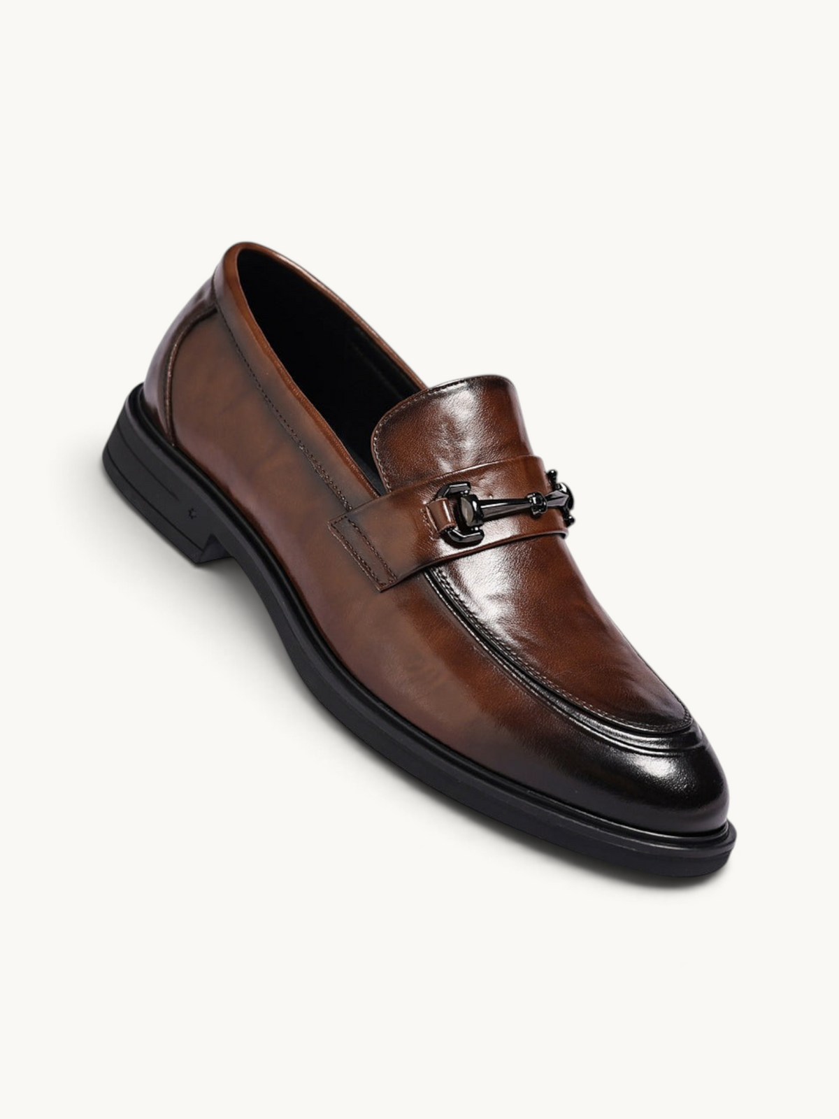 By Old Money brown leather loafers with a polished finish, black metal bit detail, and a sturdy black rubber sole.