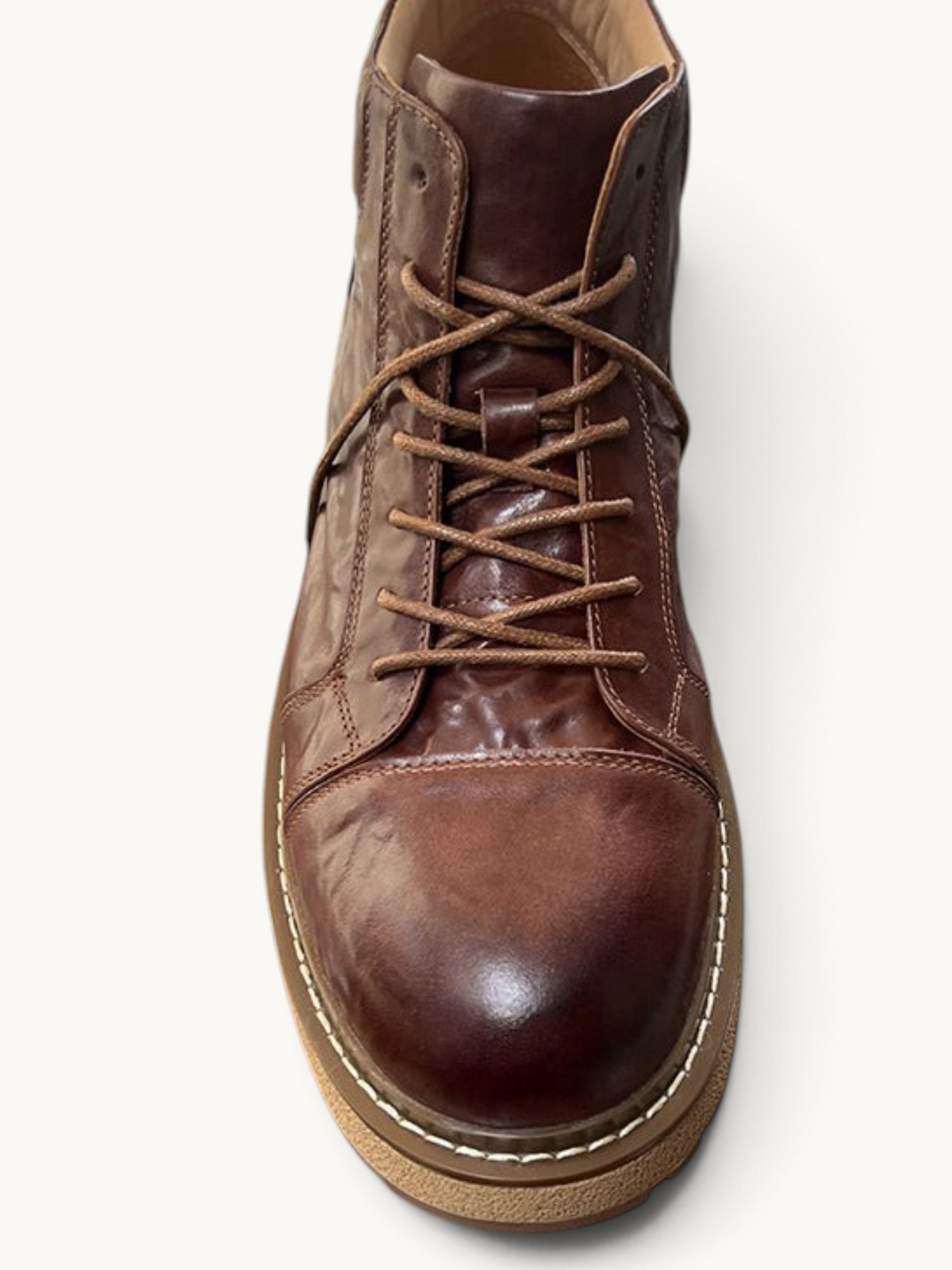 By Old Money brown full-grain leather work boots with a mid-high shaft, lace-up front, and thick lugged sole.