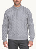 By Old Money grey cable knit half-zip sweater with a high collar worn by a man against a white background.