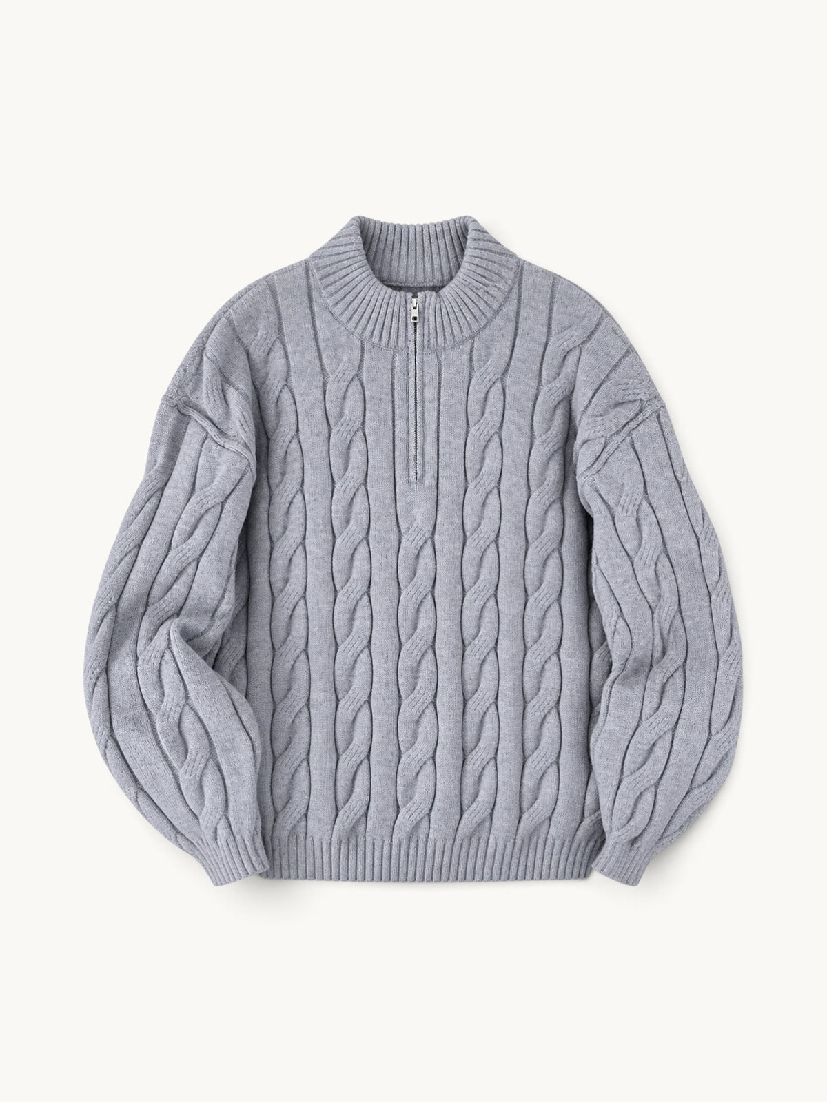 By Old Money grey cable knit half-zip sweater with a high collar and ribbed cuffs on a neutral background.