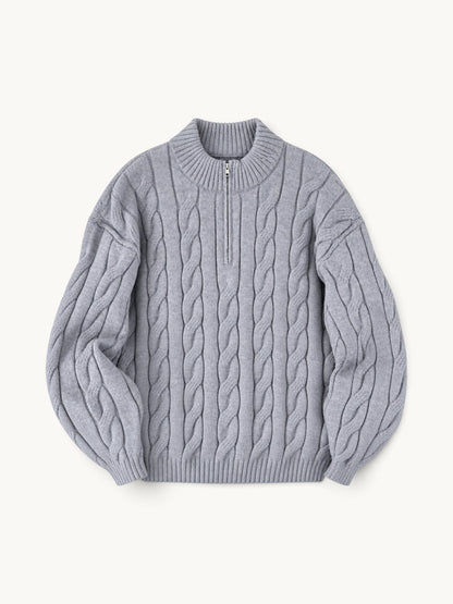 By Old Money grey cable knit half-zip sweater with a high collar and ribbed cuffs on a neutral background.