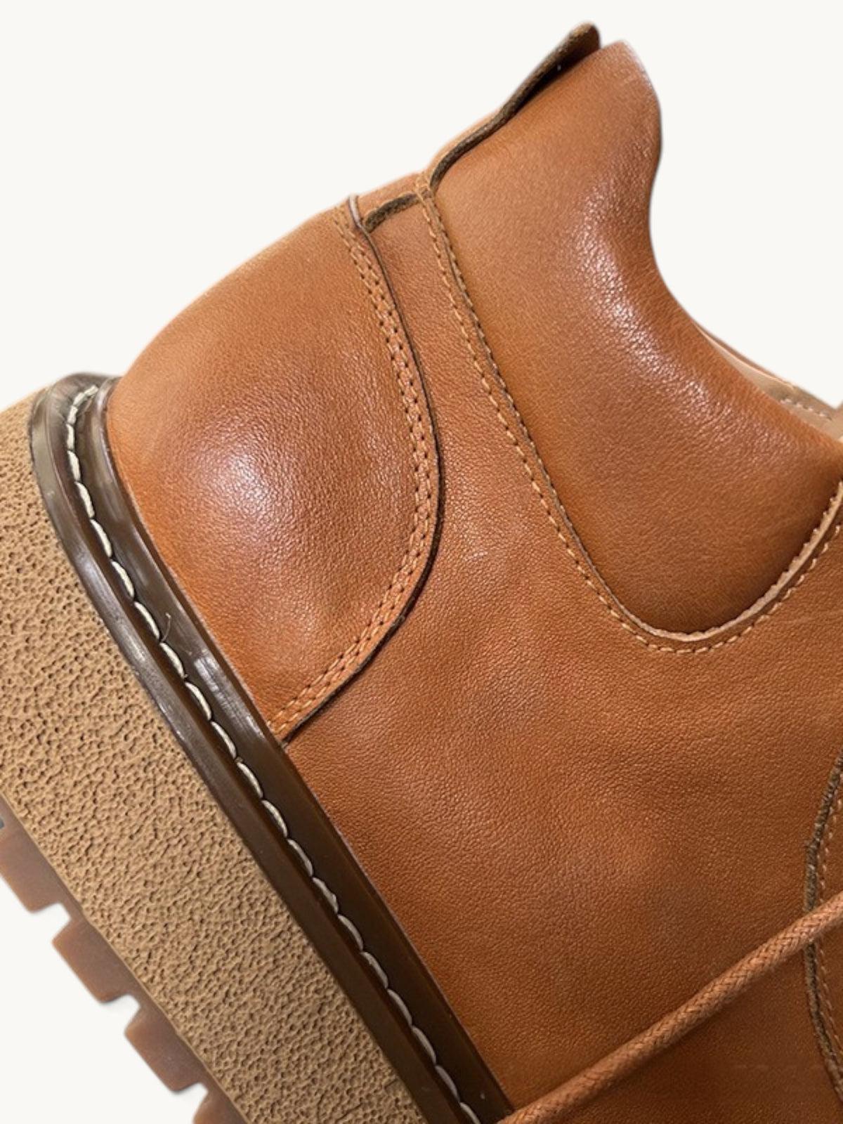 By Old Money tan full-grain leather work boot detail showing reinforced stitching and thick lugged sole