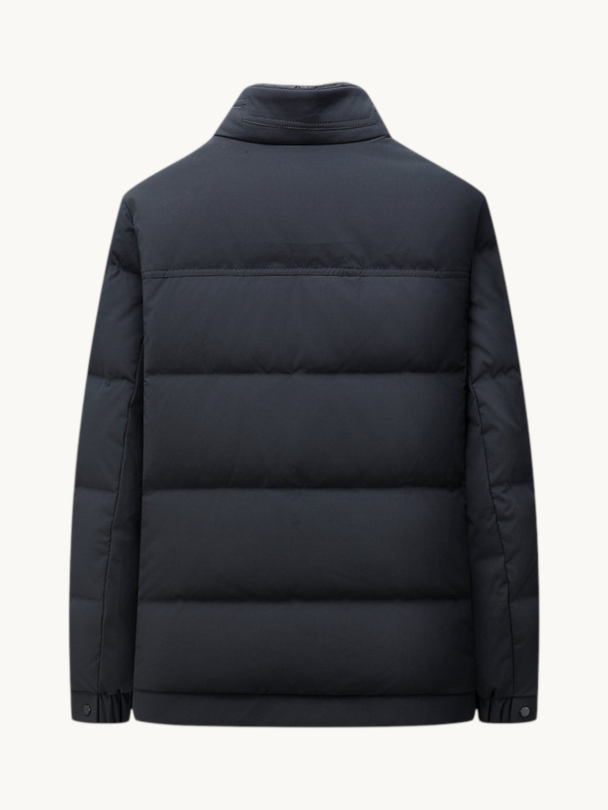 Back view of a By Old Money navy blue quilted winter puffer jacket with a high collar and straight cut