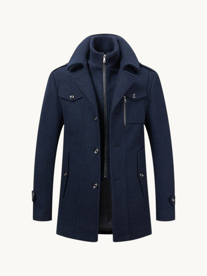 By Old Money navy blue wool coat featuring a double collar design with a zip-up inner layer and buttoned pockets.
