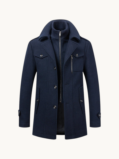 By Old Money navy blue wool coat featuring a double collar design with a zip-up inner layer and buttoned pockets.