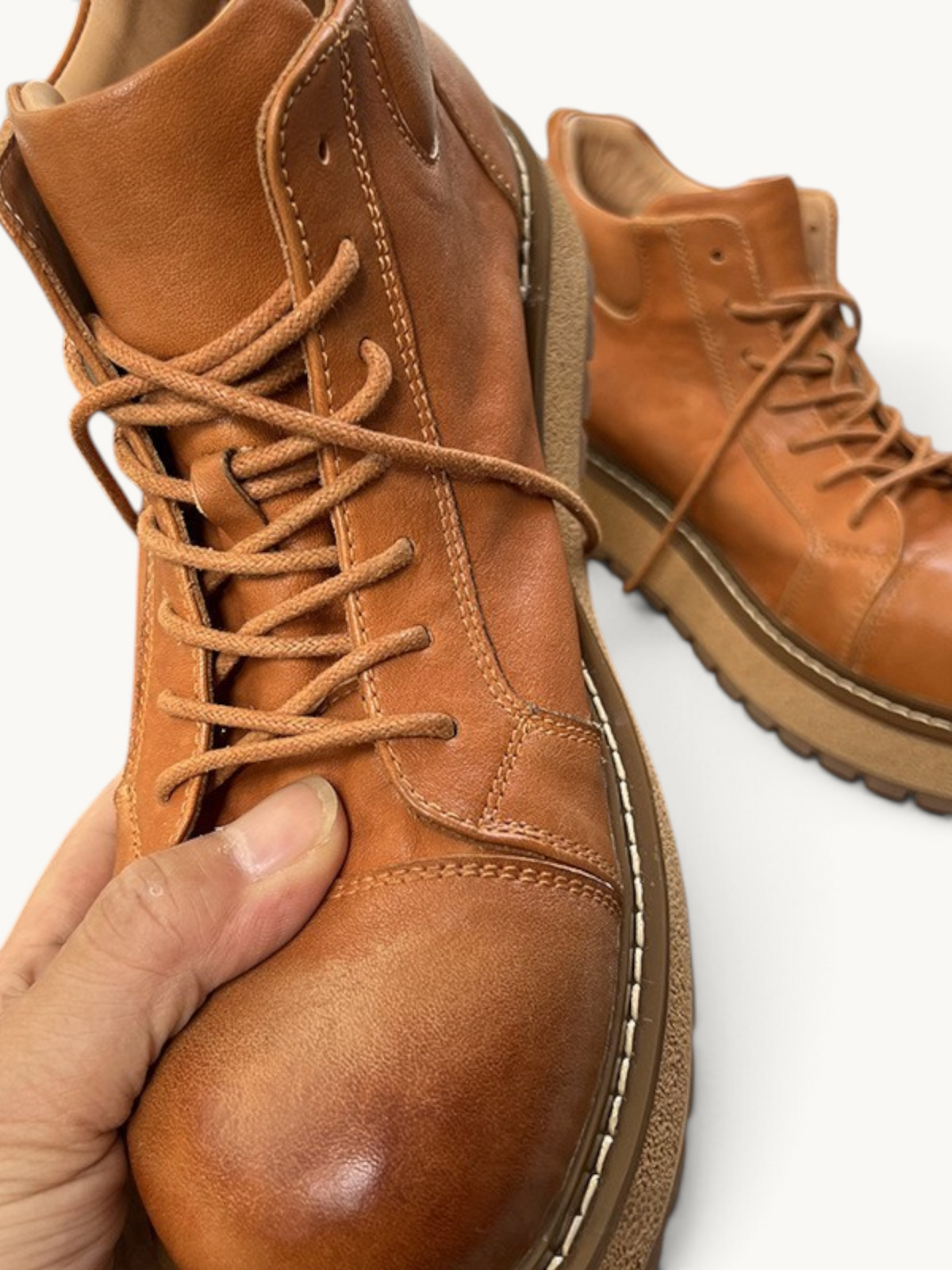By Old Money tan full-grain leather work boots with lace-up closure and thick lug soles for durable city wear.