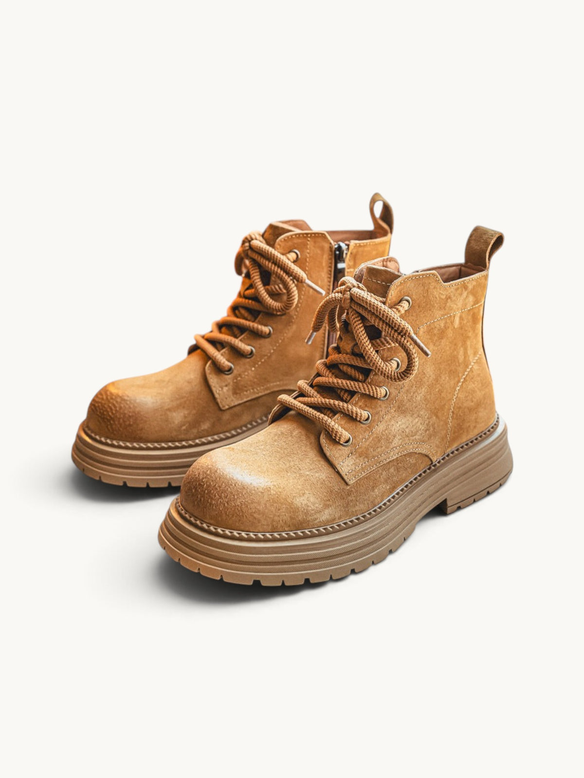 By Old Money tan suede desert boots with thick lug soles, side zip closure, and sturdy lace-up design.
