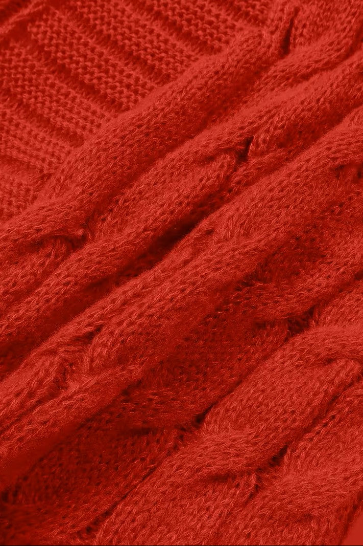 Détail de la maille torsadée d'un cardigan rouge