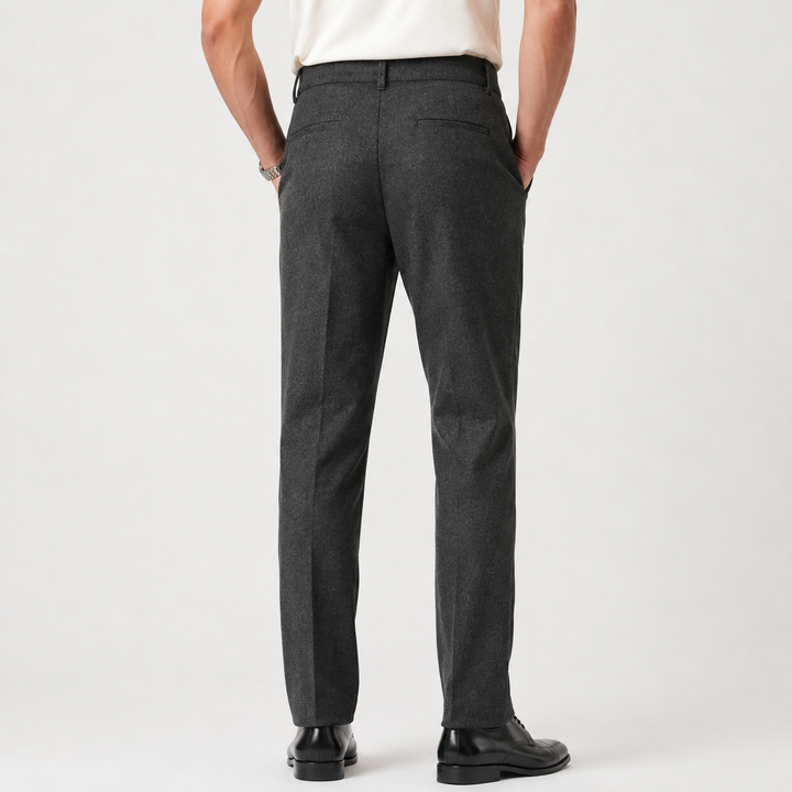 Charcoal tailored trousers with pleats and belt loops, back view on model