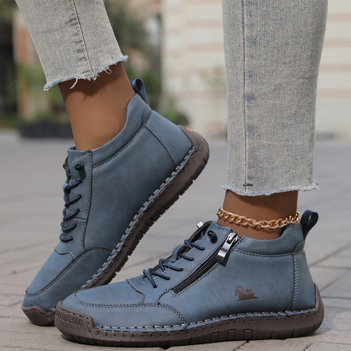 Chaussure lacée zippée, coloris bleu, vue de profil