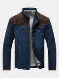 Veste matelassée à losanges bleu marine, empiècement d'épaule en daim brun et col montant