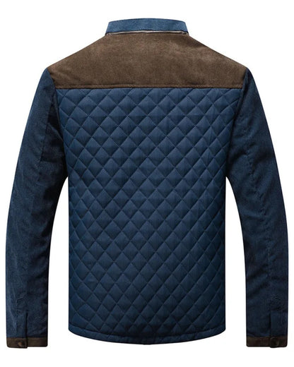 Dos de la veste matelassée bleu marine, empiècement d'épaule en daim brun