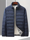Doudoune slim multi-poches, coloris bleu marine, vue de face