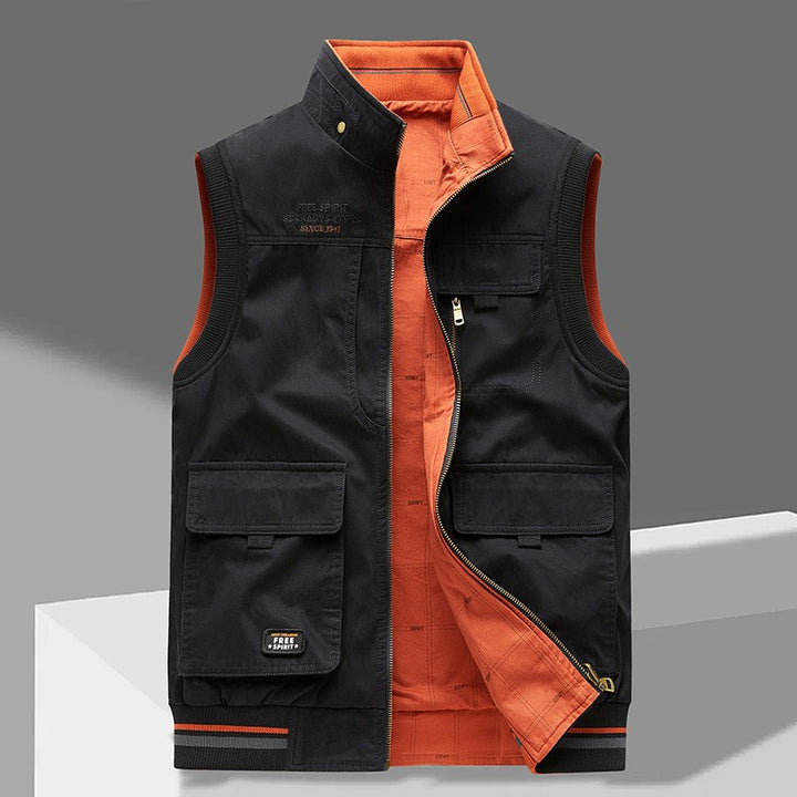 Gilet sans manches noir à col montant, face réversible orange et poches à rabat