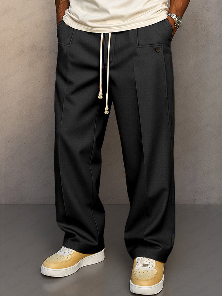 Pantalon large noir à cordon de serrage, pli marqué et jambe qui tombe droit