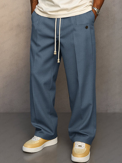 Pantalon large bleu acier à pinces et cordon écru, poches plaquées à la taille