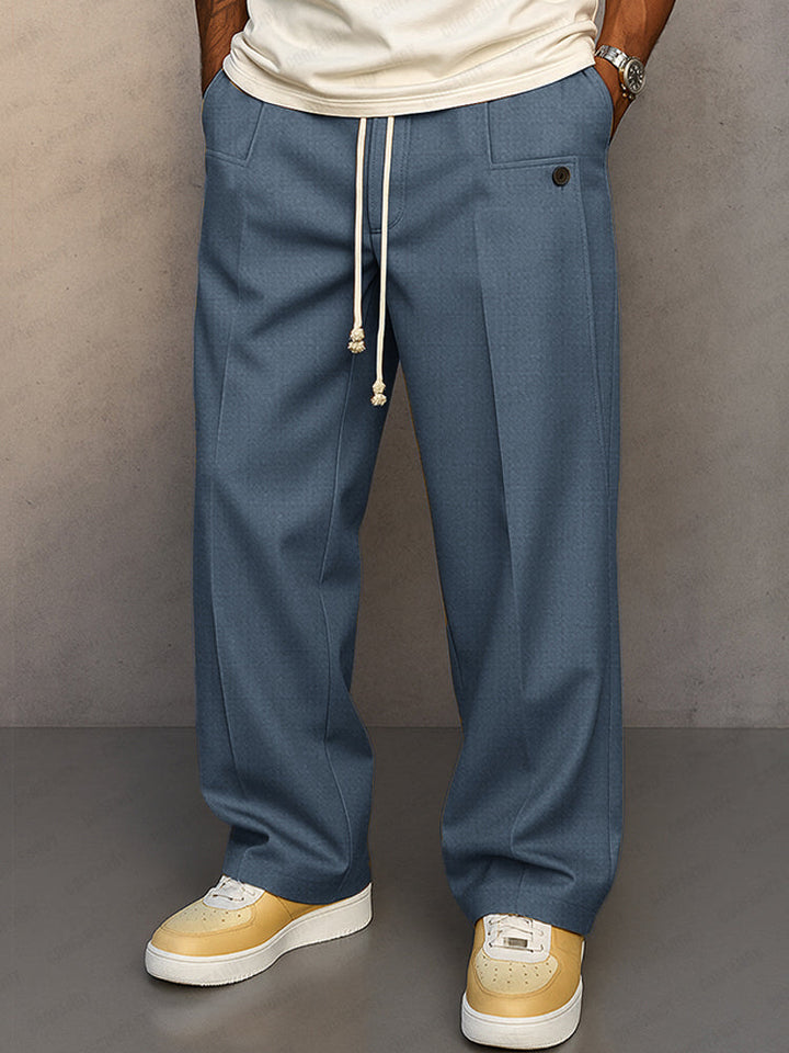 Pantalon large bleu acier à pinces et cordon écru, poches plaquées à la taille